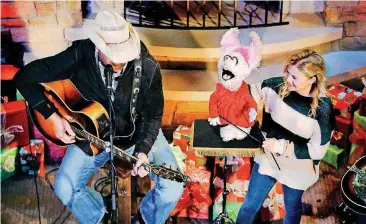  ?? [PHOTOS BY JIM BECKEL, THE OKLAHOMAN] ?? Toby Keith and Darci Lynne Farmer perform a segment for the TV special “Darci Lynne: My Hometown Christmas,” at the OK Kids Korral on Thursday in Oklahoma City.