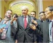  ?? THE ASSOCIATED PRESS ?? Senate Finance Committee Chairman Orrin Hatch, R-Utah, walks to a closed-door meeting Tuesday with Senate Majority Leader Mitch McConnell, R-Ky, Treasury Secretary Steven Mnuchin, and Trump’s top economic adviser Gary Cohn.