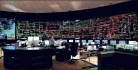  ?? Bob Klein / NYISO ?? The NYISO control room is windowless and darkened to better display the depiction of the state’s power grid.