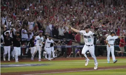  ?? Thursday. Photograph: Allison Dinner/EPA ?? The Diamondbac­ks’ Pavin Smith scores the winning run after Ketel Marte’s walk-off single in Game 3 of the NLCS against the Phillies on