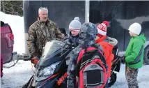  ?? SAM MCNEISH THE TELEGRAM ?? Darren Dunphy of Safety NL talks to Mary Queen of Peace Cub Pack B earlier this week about safe operation of ATVs and Snowmobile­s at the Rotary Sunshine Park Chalet in Portugal Cove-St. Philip’s. •