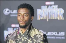  ?? PHOTO BY CHRIS PIZZELLO/INVISION/AP, FILE ?? In this 2018 file photo, Chadwick Boseman, a cast member in “Black Panther,” poses at the premiere of the film in Los Angeles. Actor Chadwick Boseman, who played Black icons Jackie Robinson and James Brown before finding fame as the regal Black Panther in the Marvel cinematic universe, has died of cancer. His representa­tive says Boseman died Friday, Aug. 28, in Los Angeles after a four-year battle with colon cancer. He was 43.