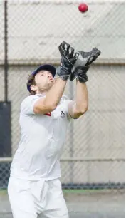  ??  ?? Nathan Bayne keeps his eyes on the ball as he safely takes this catch on Saturday in Division 1.