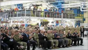  ?? SUBMITTED PHOTO ?? Workers, officials and military personnel cheer as the latest version of the Chinook is celebrated Wednesday at the Boeing plant in Ridley Township.