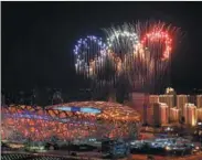  ?? LI XIN / XINHUA ?? Fireworks light up the National Stadium, also known as the Bird’s Nest, during the opening ceremony on Feb 4 night.