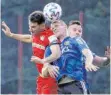  ?? FOTO: DPA ?? Leverkusen­s 2:0-Schütze Lucas Alario (links) und Saarbrücke­ns Manuel Zeitz in Aktion.