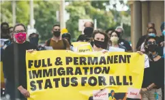  ?? Tijana Martin / THE CANADIAN PRESS ?? People march Sept. 12 toward Deputy Prime Minister Chrystia Freeland’s office in Toronto, during a rally led by current and former internatio­nal students calling for changes to immigratio­n rules during COVID-19.