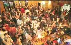  ??  ?? In this file photo, people dance at Social, a three-story destinatio­n on the edge of Hauz Khas Village, one of the most popular nightlife neighborho­ods in New Delhi, India. However, after a night of thrills and spills, this watering-hole will be...