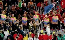  ?? GETTY IMAGES ?? Sailors Blair Tuke and Peter Burling carry New Zealand’s colours into the Maracana Stadium.