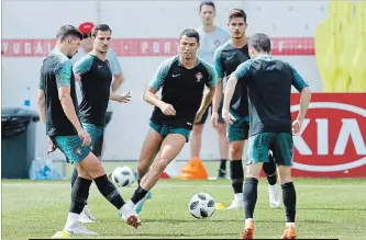  ?? VICTOR R. CAIVANO THE ASSOCIATED PRESS ?? Portugal’s Cristiano Ronaldo, centre, at practice Friday before Saturday’s Round of 16 match against Uruguay.