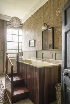  ??  ?? LEFT Probably dating from the 1940s, the steps in the main bathroom were installed when the bath was raised so that the bather could appreciate the view through the window ABOVE Elaborate marquetry furniture and a carved mahogany and gilded bed...