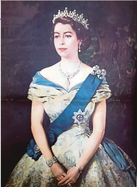  ?? PIX BY ALAN TEH LEAM SENG ?? Each Straits Times’ Coronation Issue came with a copy of Queen Elizabeth II’s portrait by Welsh artist Margaret Lindsay Williams.