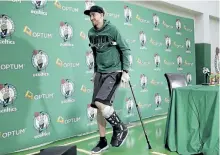  ?? STEVEN SENNE/ THE ASSOCIATED PRESS ?? Boston Celtics’ Gordon Hayward uses crutches as he steps away from a podium after taking questions from the media on Thursday. Hayward, who broke his ankle about five minutes into his Celtics debut at Cleveland on Oct. 17, says he knows he will not...