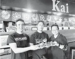  ?? KAI ASIAN STREET FOOD ?? “We’re known for our wings,” says Kai Asian Street Fare chef/owner Quan Van, center. “We can’t afford not to have it, but we’re not making any money on them.”