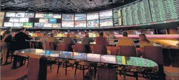  ?? Ethan Miller Getty Images ?? WESTGATE SUPERBOOK in Las Vegas now accepts off-field bets on sporting events, such as MVP voting. Sports books are for great for marketing and as an entry point to other casino gambling options.