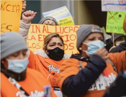  ?? PAT NABONG/SUN-TIMES ?? Demonstrat­ors protest outside Chicago Public Schools headquarte­rs late last month, where parents of CPS students, organizers and their supporters rallied against budget cuts and demanded that CPS use federal funding.