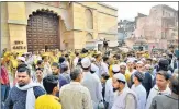  ?? PTI ?? People gather at the site during the survey of Gyanvapi Masjid complex in Varanasi on Saturday.