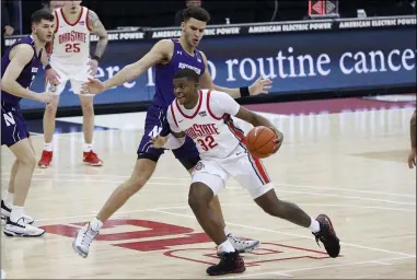  ?? JAY LAPRETE — THE ASSOCIATED PRESS ?? Ohio State’s E.J. Liddell drives against Northweste­rn’s Pete Nance during the second half Jan. 13in Columbus.