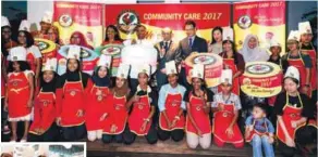  ?? ZULFADHLI ZAKI/ THESUN ?? (left) Tunku Mu’Tamir (back row, centre) with children and staff from the charity homes at the Junior Chef competitio­n, which was won by Rumah Solehah (below, far left).