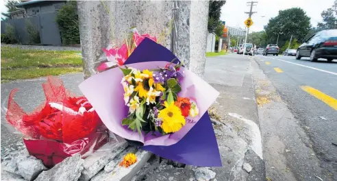  ?? Photo / Tania Whyte ?? Photos of Howard Tarr’s totalled car remind the road safety advocate about how “lucky” he is to be alive.
Flowers are placed at the site of a fatal car crash in Maunu which killed Stacey Sadlier early on Monday morning.