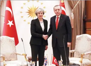  ?? ADEM ALTAN/AFP ?? Turkey’s President Recep Tayyip Erdogan (right) and British Prime Minister Theresa May shake hands after their meeting at the presidenti­al complex in Ankara on Saturday.