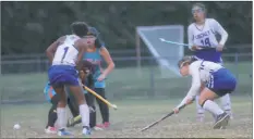  ??  ?? PHOTO BY JERRY BALLENGEE Lackey junior midfielder Hayley Tanner, right, battles for possession versus Westlake, alongside Lackey’s J’lah Watson, left, as Lackey’s Kira Thompson looks on in Wednesday’s Class 1A South Section II semifinal field hockey...