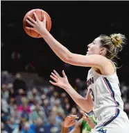  ?? SEAN D. ELLIOT/THE DAY ?? UConn’s Katie Lou Samuelson drives to the basket to score her 2,000th and 2,001st career points as a Husky in the second half of Sunday’s AAC women’s basketball game against South Florida at Gampel Pavilion in Storrs. Please go to theday.com to view a photo gallery.