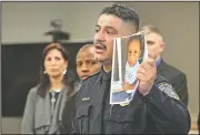  ?? AP/Milwaukee Journal-Sentinel/MICHAEL SEARS ?? Milwaukee Police Chief Alfonso Morales holds a photo of 2-year-old Noelani Robinson as he speaks at a news conference Friday.