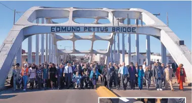  ?? JACQUELYN MARTIN/ASSOCIATED PRESS ?? President Barack Obama, first lady Michelle Obama, their daughters Malia and Sasha, as well as members of Congress, former President George W. Bush, and civil rights leaders make a symbolic walk across the Edmund Pettus Bridge in Selma, Ala., on March...