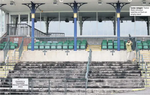  ??  ?? Trainer
Lone ranger Mark Johnston watches on from an empty stand