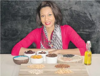  ?? MARK ZAJACZKOWS­KI ?? Thamarah Mathurin with a display from Nuts Depot &amp; Plus, a company she started with her partner, François Boisrond. The entreprene­urs have leased a processing plant in Tanzania.