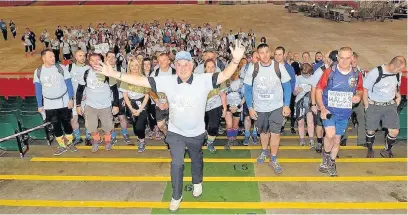  ??  ?? Sir Gareth Edwards leads the big walk in aid of prostate cancer