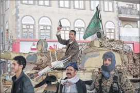  ?? HANI MOHAMMED / AP ?? Houthi Shiite fighters guard a street leading to the residence of former Yemeni President Ali Abdullah Saleh, in Sanaa, Yemen, on Monday. Saleh was killed by Shiite rebels Monday as their forces battled for control of the capital.