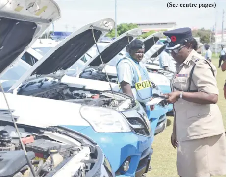  ?? (Department of Public Informatio­n photo) ?? Deputy Commission­er of Operations of the Guyana Police Force, Maxine Graham conducting the first inspection of the Chinese-donated vehicles at the Eve Leary Ground yesterday.