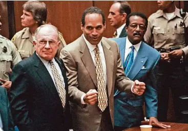  ?? Daily News file ?? O.J. Simpson, center, reacts as he is found not guilty of murdering ex-wife Nicole Brown Simpson and her friend Ron Goldman, with attorneys F. Lee Bailey, left, and Johnnie Cochran Jr., Oct. 3, 1995, in Los Angeles.