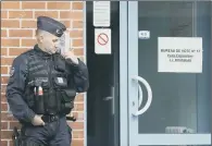  ??  ?? A police officer outside a polling station for the presidenti­al election in Henin-Beaumont, northern France.