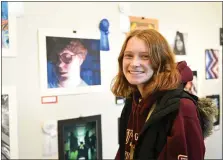  ??  ?? Anna Drake, a senior at Wilson High School, poses with her oil and pastel painting that won first place Sunday in the Senior High Juried Art Exhibit at the Yocum Institute of Arts Education in West Lawn.