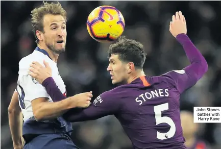  ??  ?? John Stones battles with Harry Kane