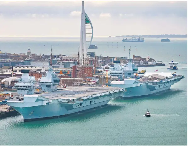  ?? ?? HMS Queen Elizabeth, left, moored next to HMS Prince of Wales in Portsmouth, suffered an ‘issue’ with a propeller shaft spotted during final checks, 18 months after its sister ship broke down with a similar malfunctio­n