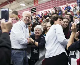  ?? MADDIE MCGARVEY / NEW YORK TIMES FILE (2018) ?? Former Vice President Joe Biden greets attendees at a campaign event for Amy McGrath on Oct. 12 in Owingsvill­e, Ky. Biden has carefully built a network of nonprofits and academic centers, staffed by his closest strategist­s and advisers — effectivel­y a campaign-in-waiting, poised to metamorpho­se if Biden announces his third bid for the presidency.