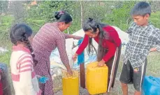  ?? ?? Locals can now get water from taps in the village.