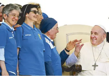  ?? AFP ?? Pope Francis smiles at a group of nuns at the end of his weekly general audience in St. Peter’s Square yesterday. Pope Francis said he was ‘heartbroke­n’ over the school shooting in Texas, which left 19 children and two teachers dead, and condemned the arms trade.