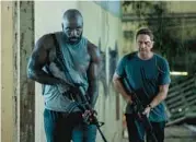  ?? LIONSGATE ?? Mike Colter, left, and Gerard Butler star in “Plane,” directed by Jean-Francois Richet.