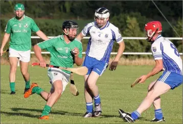  ??  ?? David Doyle of St. James’ tries to find a route beyond Craanford duo Ger Lyons and James O’Loughlin.