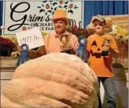  ?? HAROLD HOCH - FOR MEDIANEWS GROUP ?? Craig Gardecki set the Oley Fair pumpkin weight record of 1,477 pounds, and for the third straight year, Brandon Heckman won the youth division at 971 pounds.