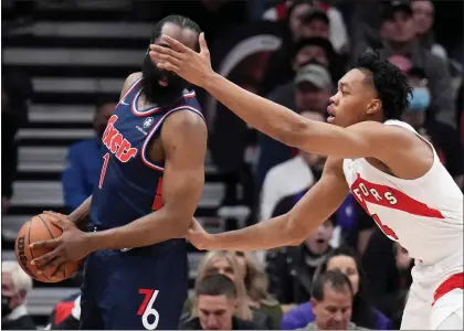  ?? NATHAN DENETTE — THE CANADIAN PRESS VIA AP ?? Toronto Raptors forward Scottie Barnes, right, seems to challenge James Harden to shoot blindly during Game 4of their series on Saturday. At this rate, maybe it’s not such a bad idea.