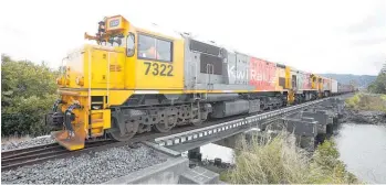  ?? Photo / Michael Cunningham ?? Containers on the way to Auckland from Whanga¯ rei by rail in January after being trucked from Northport.