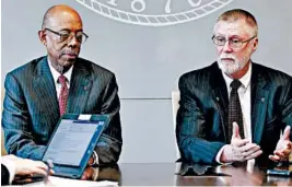  ?? JAY LAPRETE/AP ?? School President Michael Drake, left, and provost Bruce McPheron answer questions about the findings Friday in Columbus, Ohio. Dr. Richard Strauss killed himself in 2005.