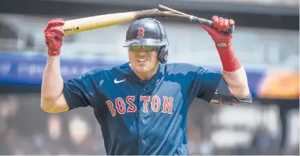  ?? NIC ANTAYA/GETTY ?? Red Sox’s Hunter Renfroe breaks a bat over his head during the fourth inning of Thursday’s game against the Tigers at Comerica Park in Detroit.