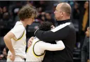  ?? RAY CHAVEZ — STAFF PHOTOGRAPH­ER ?? Granada's Matai Faiaipa'u is comforted by an assistant coach after losing in the CIF State Division I title game.